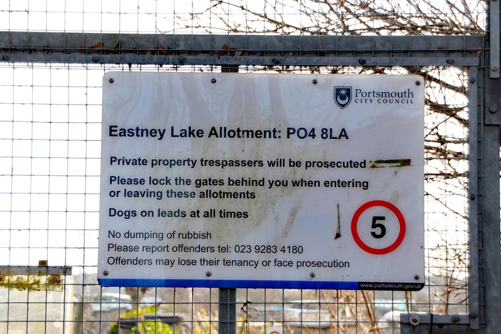 Signage on the entrance gate at Eastney Lake allotments, Portsmouth.