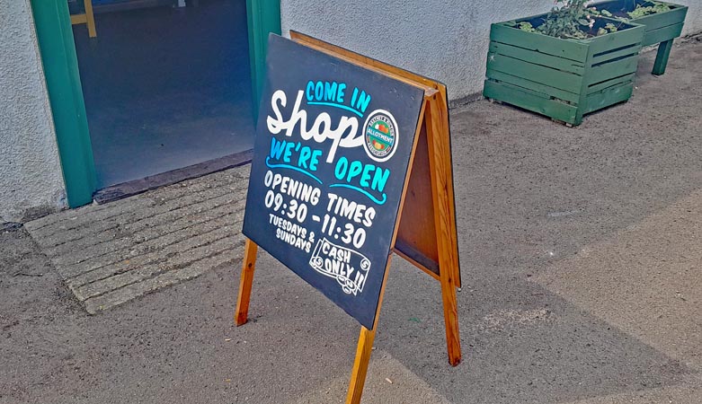 Allotment shop open sign.